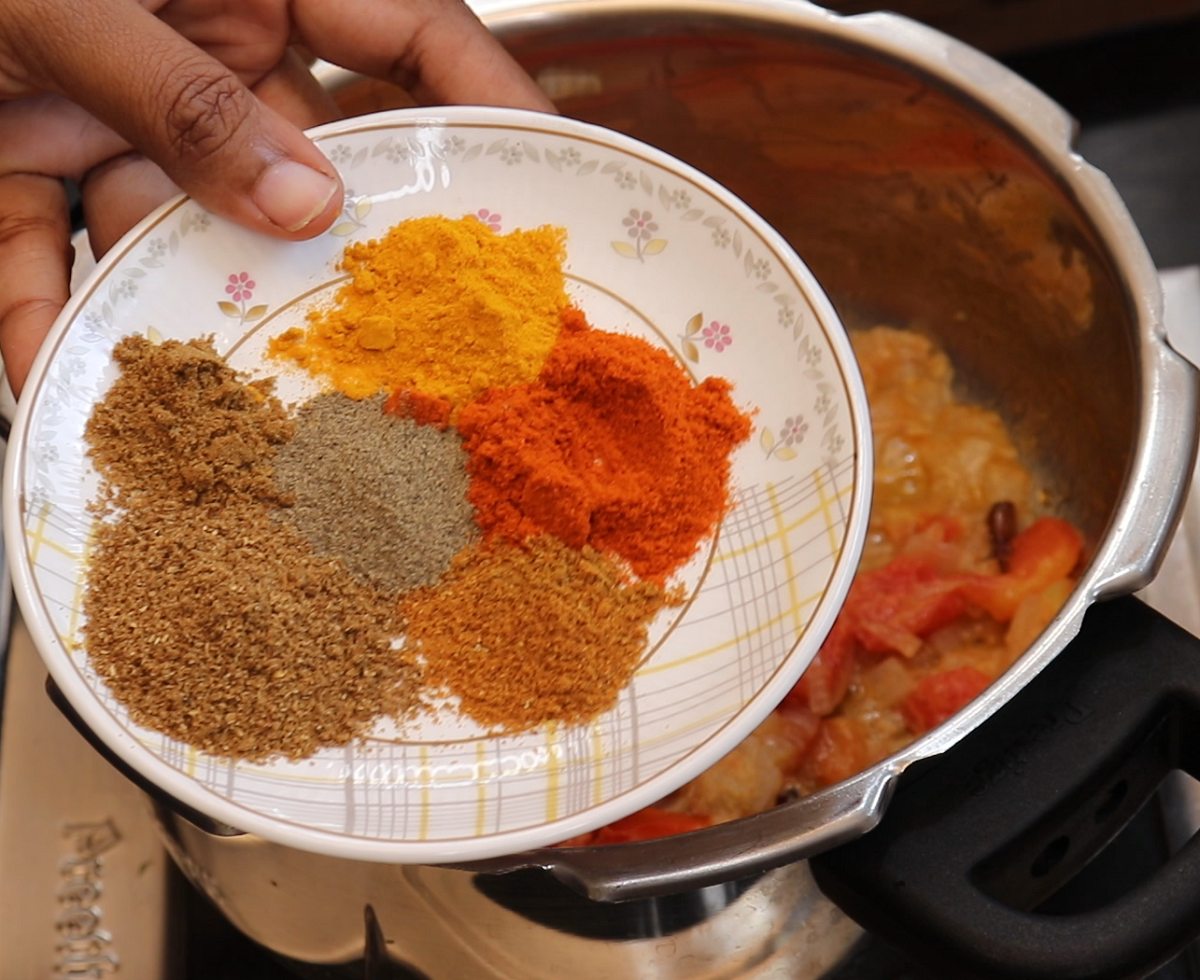 Add in Chilli Powder, Turmeric Powder, Coriander Powder, Pepper Powder and Garam Masala Powder