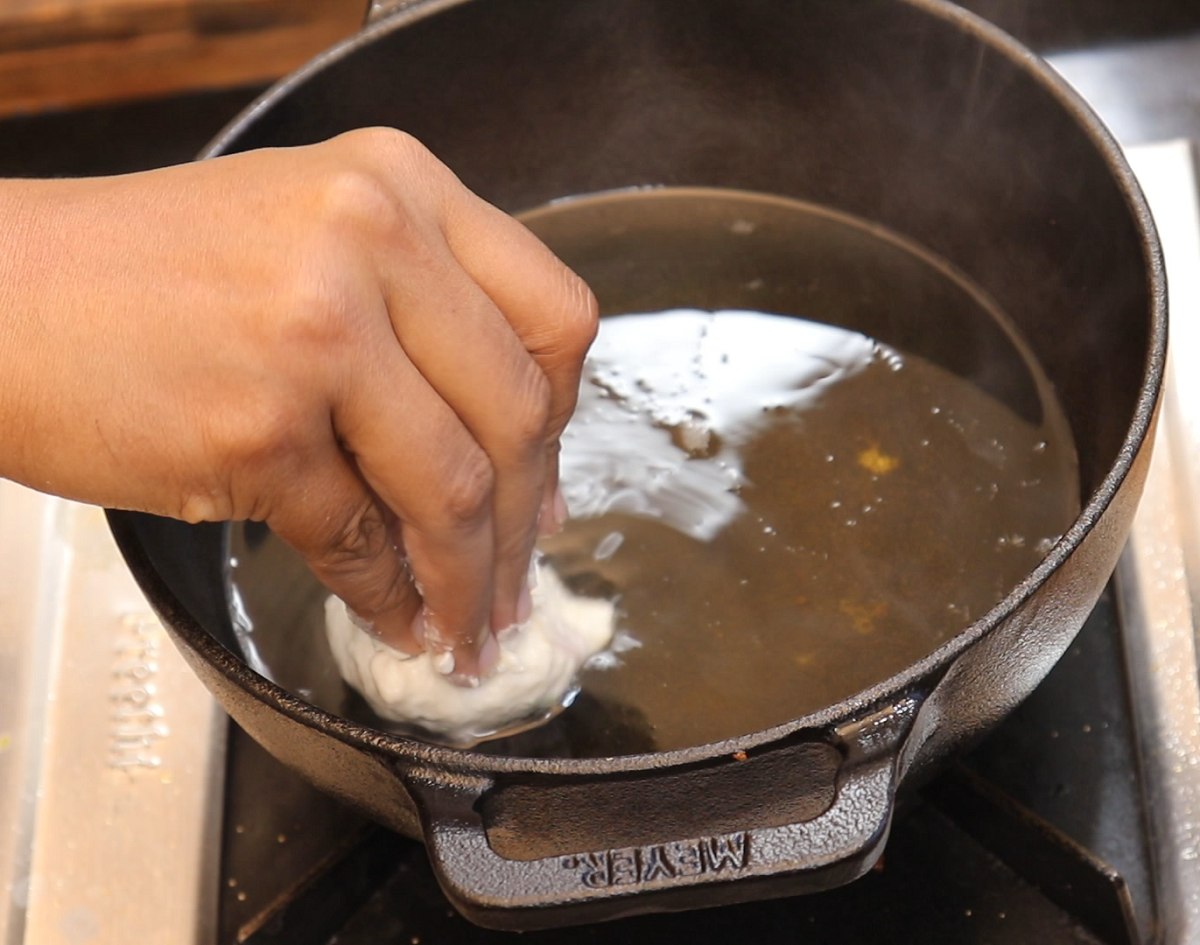 Drop the medu vada balls carefully into oil