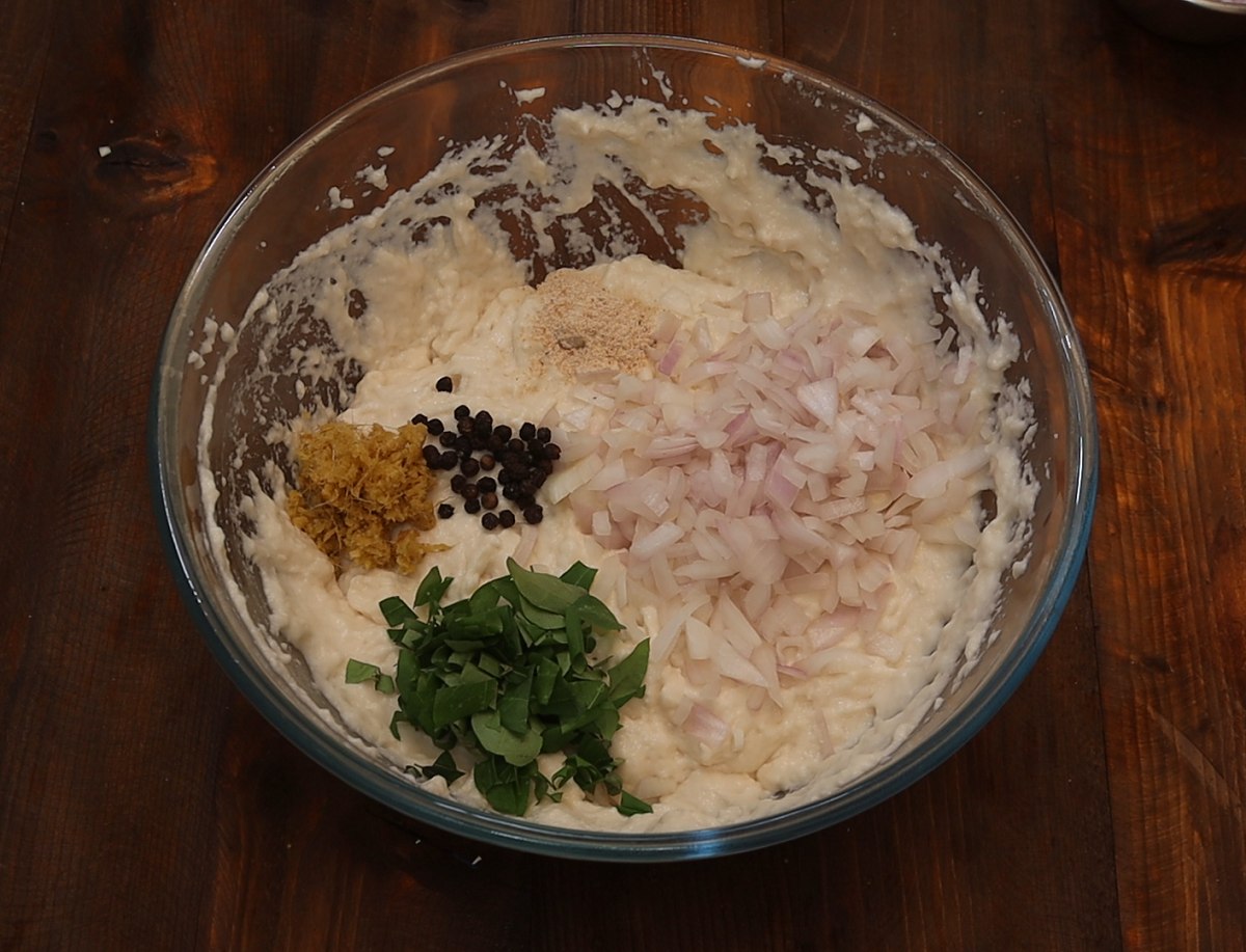 Add Onion, Ginger, Pepper, Curry Leaves, Asafoetida powder and salt into the urad dal batter.