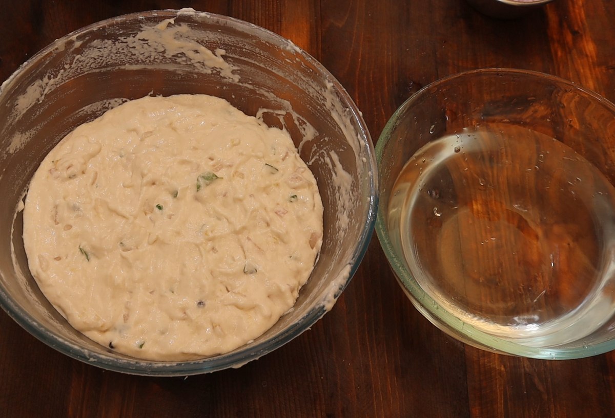Wet your hands in water and start making urad dal vada balls